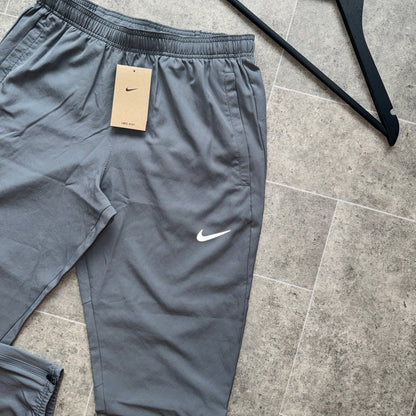 NIKE DRI-FIT CHALLENGER PANTS - GREY